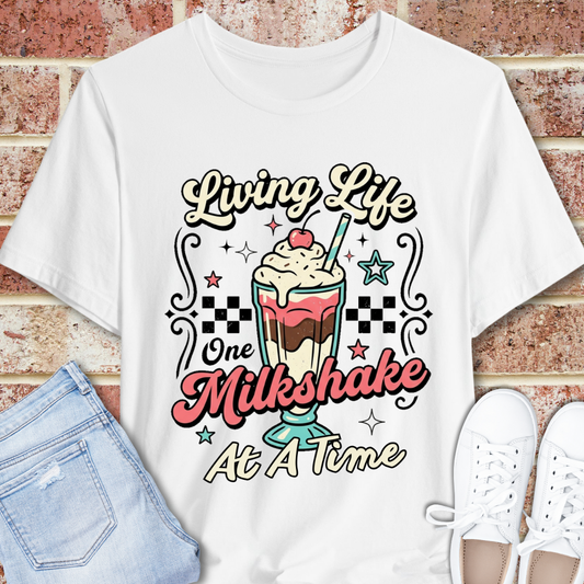 Milkshake Graphic Tee — "Living Life One Milkshake at a Time" Retro Dessert T-Shirt