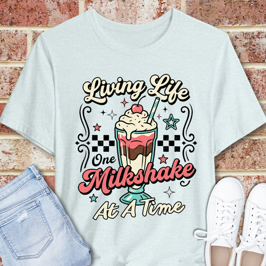 Milkshake Graphic Tee — "Living Life One Milkshake at a Time" Retro Dessert T-Shirt