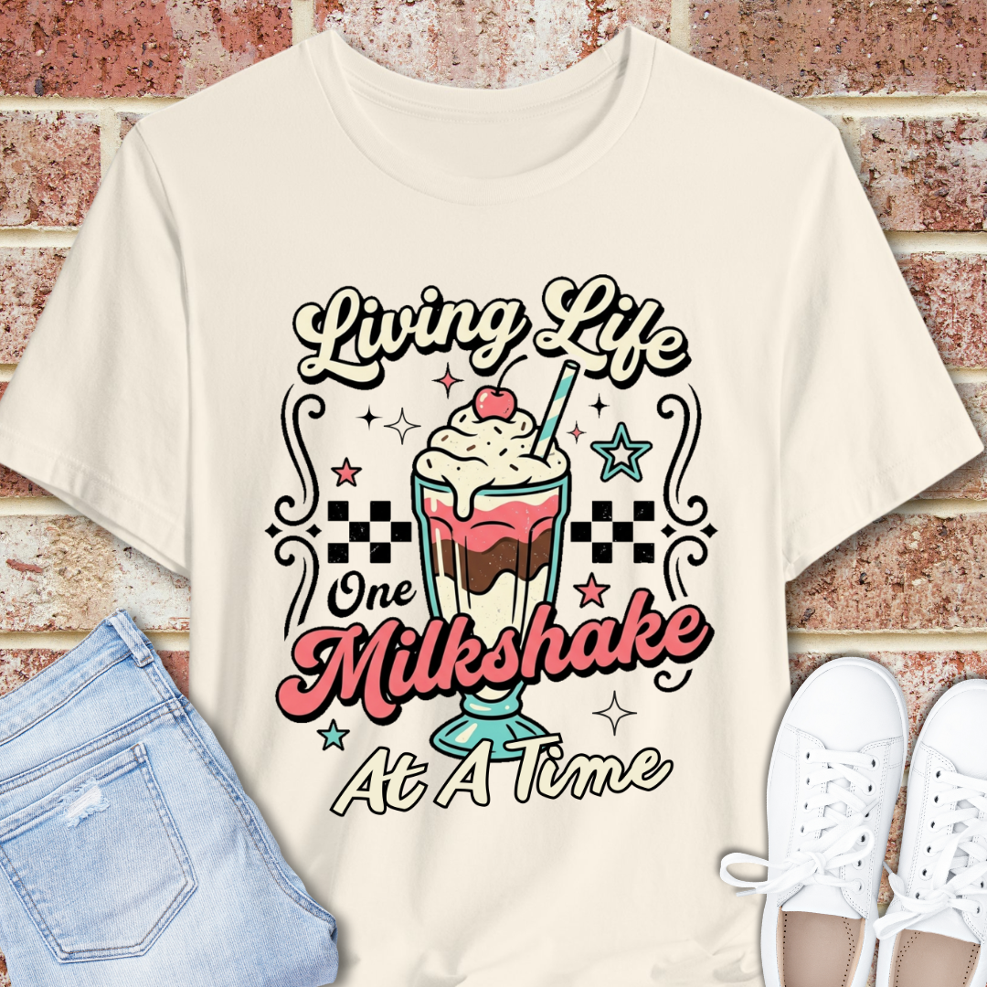 Milkshake Graphic Tee — "Living Life One Milkshake at a Time" Retro Dessert T-Shirt