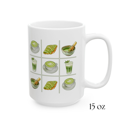 Close-up view of 15oz white ceramic mug with a matcha tic-tac-toe design of green lattes, matcha croissants, iced matcha, and whisked matcha bowls