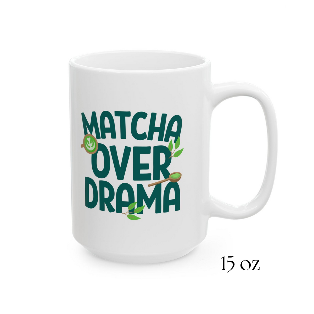 Close-up view of white ceramic "Matcha Over Drama" coffee mug with mini images of green tea leaves, a matcha latte, and wooden spoon filled with matcha powder, 15oz
